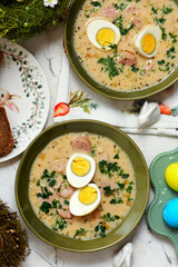 Traditional Polish Easter soup with horseradish, smoked meats and egg..top veiw