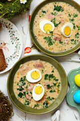 Traditional Polish Easter soup with horseradish, smoked meats and egg..top veiw