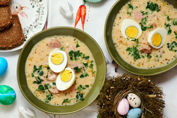 Traditional Polish Easter soup with horseradish, smoked meats and egg..top veiw