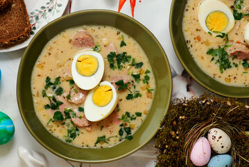 Traditional Polish Easter soup with horseradish, smoked meats and egg..top veiw
