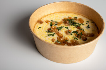 Traditional Ukrainian banosh porridge with crispy pork cracklings and fresh dill. Creamy texture...