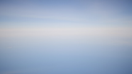 Obraz premium Fading stratus clouds merging with the ozone layer above, creating a smooth, almost imperceptible gradient in the sky, Stratus Fading Ozone, Smooth atmospheric gradient