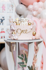 A delightful and charming pink themed birthday cake designed for a special first celebration, beautifully adorned with cute teddy bears and elegant decorations that capture the spirit of the occasion