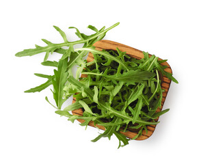 Fresh arugula leaves in square wooden bowl isolated on white background top view. Leaf vegetable for diet and healthy eating.