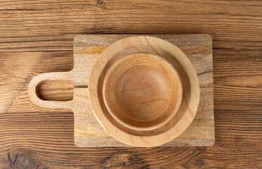 Empty wood bowl on table, plate stack on wooden table, light rustic dish mockup, eco bio