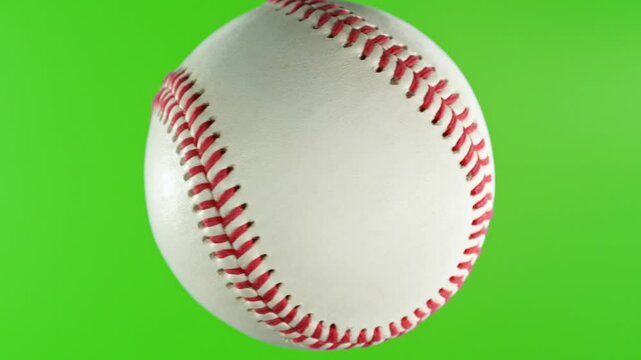 Rotating White Baseball Ball on Green Screen Background . Filmed on High Speed Cinematic Camera at 1000 fps