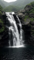 Majestic waterfall cascading over rocky cliff in serene forest landscape