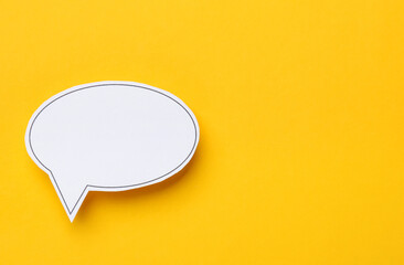 Blank speech bubble on yellow background, top view. Space for text