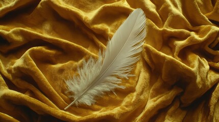 Soft white feather resting on luxurious golden velvet fabric, symbolizing lightness, purity, and elegance in a cozy and stylish setting