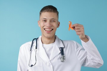 Multiple Sclerosis awareness. Doctor with orange ribbon on light blue background