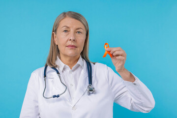 Multiple Sclerosis awareness. Doctor with orange ribbon on light blue background