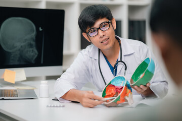 Doctor Analyzing X-Ray Scan a Skull in Hospital, Medical Professional Using Radiology Science to...