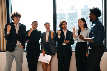Obraz premium Celebrate and victory to business success with colleagues. Business celebration party event with co-worker partner in business marketing team, winner successful with startup teamwork together