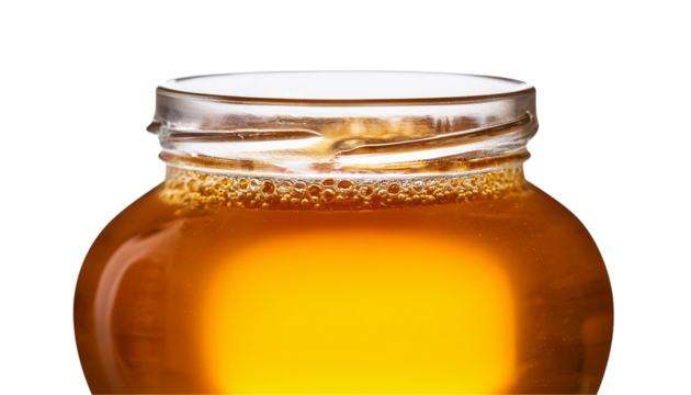 Honeycomb and two glass jars with honey. Fresh organic honey on white table background with shadow sunlight. Copy space