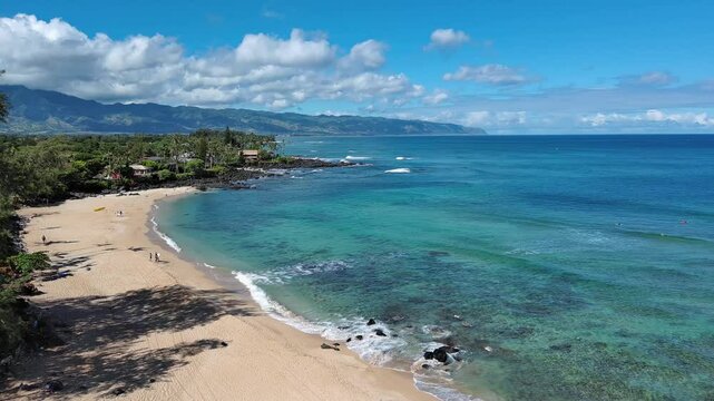 Aerial view of Chun's reef small wave surfing on North Shore of Oahu, Hawaii