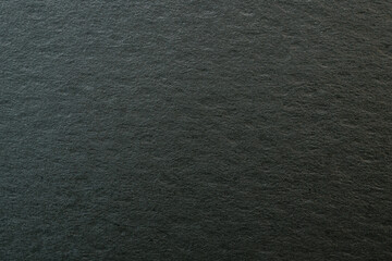 Dark Textured Surface with Subtle Patterns and Depth