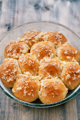Ruddy buns with garlic lie on a plate on the table