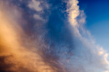 orange clouds in blue sky