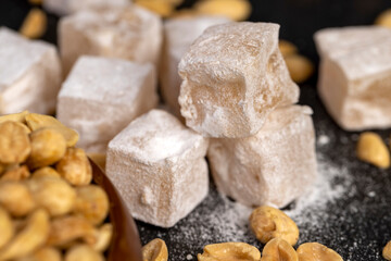 square Turkish delight in powdered sugar with nuts inside
