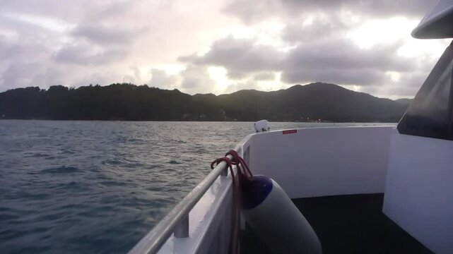 Ship on Indian Ocean at sunset, Praslin island, Seychelles