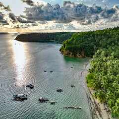 Aerial view from a drone, of a late afternoon Sun over a harbour in Glan, Sarangani, Philippines