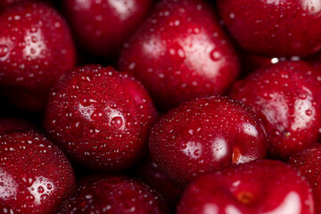 delicious ripe red cherry berries in drops of water