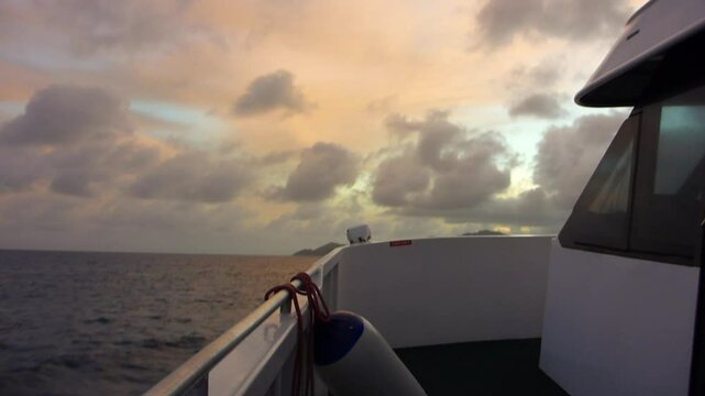 Ship on Indian Ocean at sunset, Praslin island, Seychelles