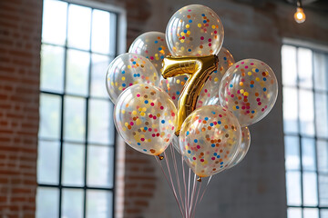 Colorful balloons celebrating a child's seventh birthday in a bright indoor space with large windows