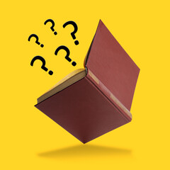 Question marks flying out from open book on yellow background