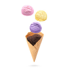 Ice cream scoops and waffle cone in air on white background