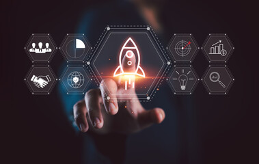 Startup business concept, Strategic planning and business success. Businessman touching rocket icon...