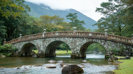 Fototapeta premium Stone Arch Bridge over Mountain Stream