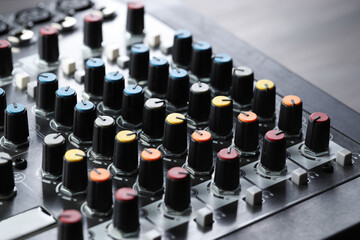 Professional mixing console on table, closeup. Radio studio equipment