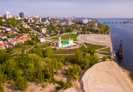 Aerial view of Admiralty square of Voronezh with Assumption Church and Ship Museum on background with modern cityscape, Russia..