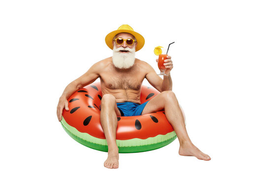 Senior man summer vacation with inflatable and cocktail drink on transparent