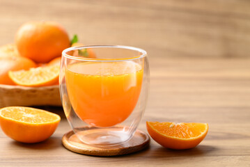 Glass of orange juice and fresh orange fruit on wooden background, Healthy drink