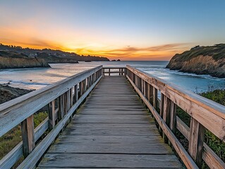 Fototapeta premium Wooden pier extending to ocean sunset.