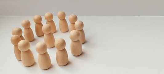 Group discussion workshop indoor setting wooden figurines collaborative environment top-down view team building concepts