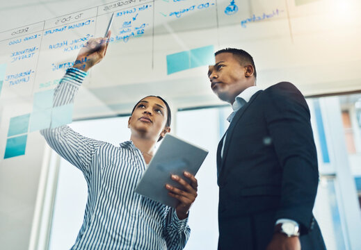 Business, people and writing ideas on glass for planning schedule, daily task and reminder notes. Below, teamwork and tablet with to do list, checklist and productivity update for deadline management