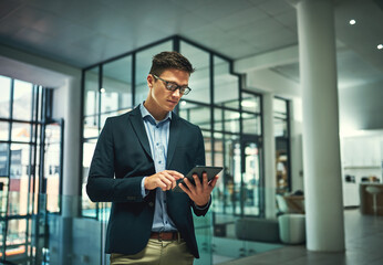 Fototapeta premium Tablet, serious and business man research for information, update or reading email for news. Technology, internet and financial consultant on app for budget, investment or check share price in office