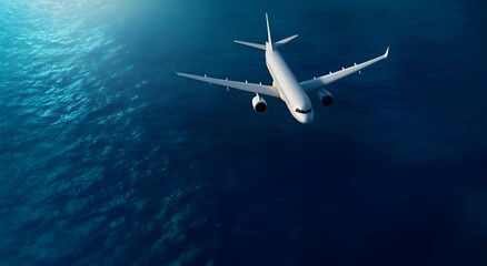 Obraz premium Aerial view of a white commercial airplane flying over clear blue ocean water, symbolizing travel and adventure in the skies.