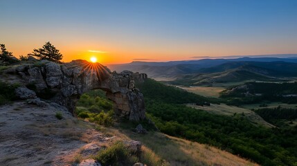 Obraz premium Sunrise Arch Majestic Dawn over Mountain Valley.