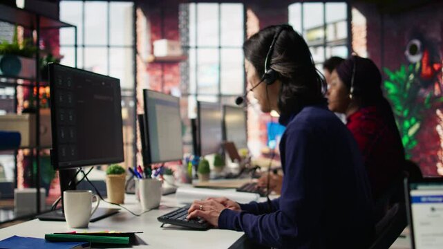 Call center agent using AI chatbot to provide quick and accurate replies to common customer queries. Customer service representative generating automated responses to clients using AI, camera B
