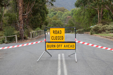 Road sign road closed burn off ahead