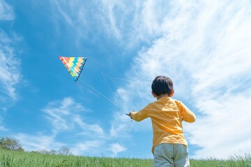 children in bright clothing playing with colorful kites under clear blue sky surrounded by green fields