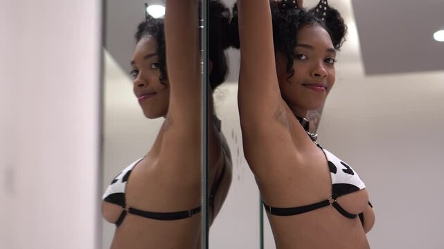 Young Sexy Woman in Lingerie Posing For Camera by Mirror