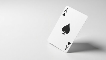 Side view of a flipped playing card against a white backdrop , spade, detail