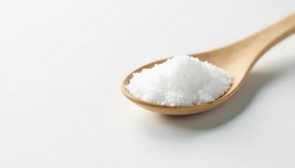 Spoonful of white sugar against white backdrop, baking, table sugar, sprinkles