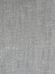 A textured gray fabric surface with subtle variations, creating a soft and natural appearance.