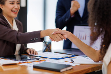 Business handshake for teamwork of business merger and acquisition,successful negotiate,hand shake,two businessman shake hand with partner to celebration partnership and business deal concept
